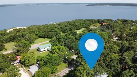 Spacious Modern Lake Retreat w/ Deck! Only a short Walk to Swimming and Fishing!