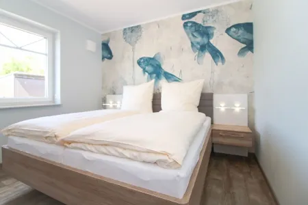 Modern first floor apartment with sauna and beach chair in the garden for 4 persons Отели в г. Норден