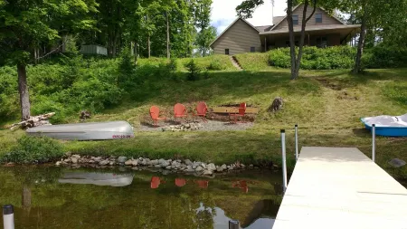 Beautiful newer home on the sunny side of peaceful Camp Lake in Iron River