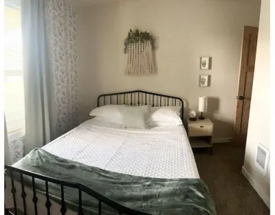JSW Away Stay featuring 1 King size bed, 2 queen size beds, and 2 baths Hotels near Quinn Coliseum