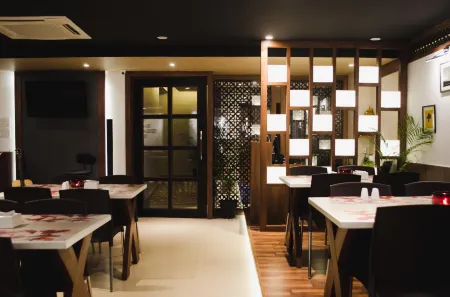 Hotel Tranquil Manipal Отели рядом с достопримечательностью «Botany Garden (Botanica)»