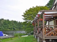 Holiday Home by Lake Rosnowskie with Boat