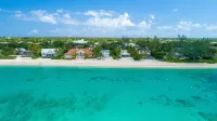 7 Mile Beach Beach Penthouse. Ocean views from Roof Terrace and a Pool Pavilion