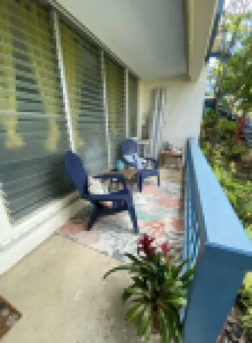 Tropical one bedroom condo steps from pool.