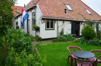 Stylish apartment with garden in a former farmhouse in De Waal Hotels near Texelse Dranken
