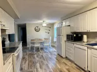 Come for the Sun, Stay for the Fun in this charming 3 Bedroom Porch Home