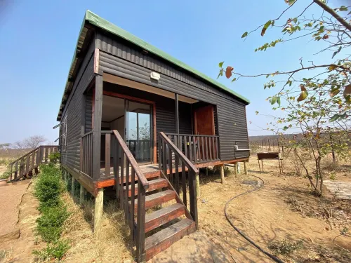 Cozy wooden cabin overlooking the foot of the Tswapong Hills in Palapye. Hotels in Palapye