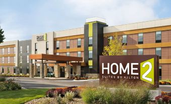 an exterior view of a hotel building , possibly a hotel or inn , located in a rural area at Home2 Suites by Hilton Joliet/Plainfield