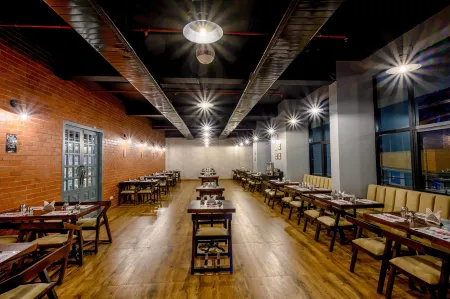 Essentia Manipal Inn Отели рядом с достопримечательностью «Botany Garden (Botanica)»