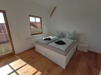 Exclusive, sunny new-build vacation apartment with the flair of a former barn Hotels in Görisried