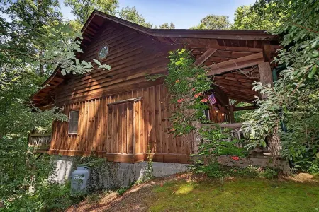 A Laurel Haven, with big porches and a log cabin feel. Fireplace.