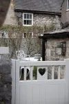 Cosy contemporary  cottage in village with own courtyard & original features.