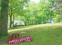 Scenic Grounds with Cozy Cabins and Stocked Pond - Charming Escape