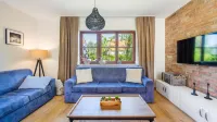 Domy Nad Jeziorem Sun & Snow Osada Zamkowa Hotels in Pasym