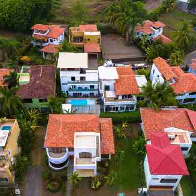 Steps from beach with private pool, rooftop terrace & swim up bar beach club! Hotel Exterior
