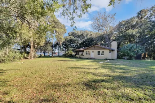 Lakefront home on Lake Kerr near Salt Springs with large porch and great yard