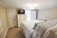 Lakeside Retreat with Guest Cottage on 5+ Acres