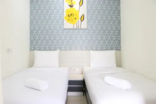 Simply 2BR Apartment at Parahyangan Residence By Travelio