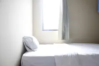 Minimalist 3Br Gateway Cicadas Ahmad Yani Apartment by Travelio - Homestays