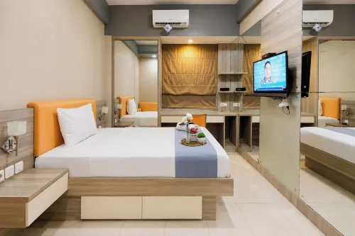 Calming Wooden Touch Studio Room At Apartment Soekarno Hatta (Suhat) Malang - Apartments