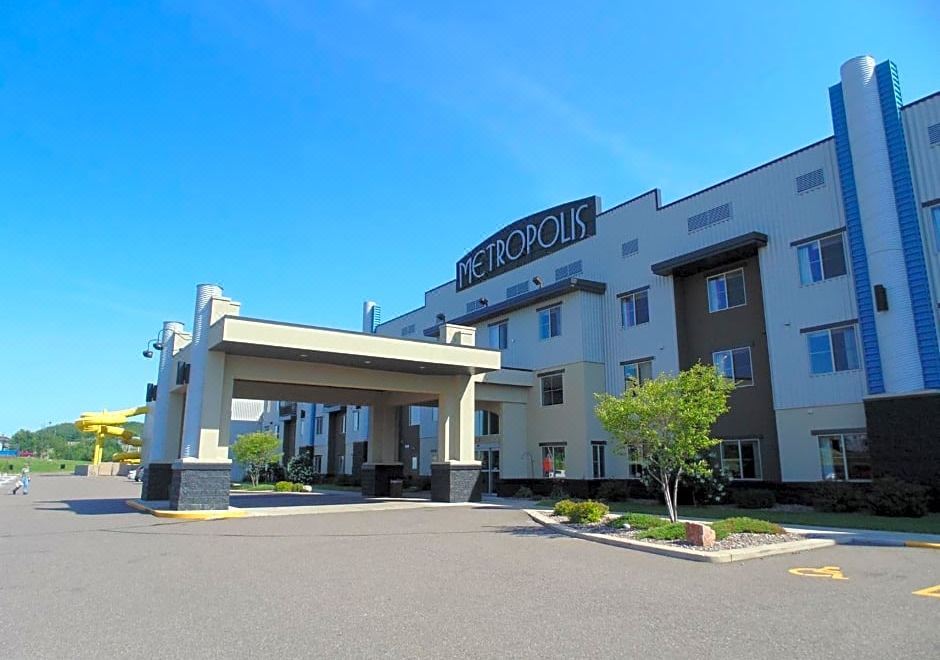 "a large building with a sign that reads "" metropio "" is shown in front of a parking lot" at Metropolis Resort - Eau Claire