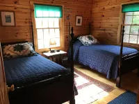 QUINTESSENTIAL MAINE LOG CABIN SET ON GORGEOUS LAKE