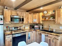 Elegant, Cozy Cub Cabin near Lake with a Full Kitchen & Laundry Unit in Big Lake