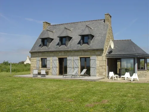 Fishing house in front of the sea.