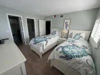 End unit with extra windows. Steps to the beach, private beach access!