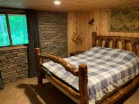 Beautiful Log Cabin 11ac. 4 br. 2.5 ba. on snowmobile trails in Manistee forest.