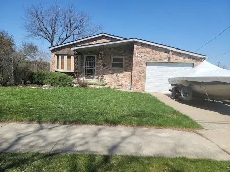 Waterfront with Boat Dock on Detroit River Channel. Fish from the Backyard