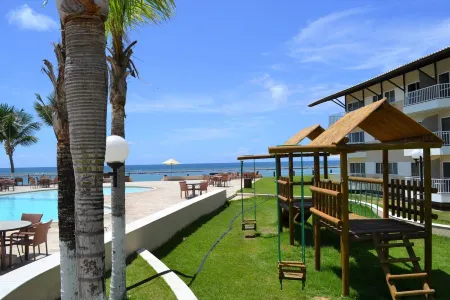 Flat Ground Floor Special with balcony in Marupiara Suites Flat 120 - 12x semjuros Отели рядом с достопримечательностью «Port of Suape»