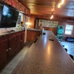Former bar with games, multiple kitchens, 5 bedrooms, sleeps 14.