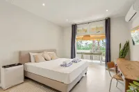 Royal Beach House with sea view and large community pool.