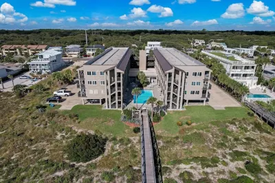 Newly Remodeled Oceanfront Condo with Salt Water Pool and Private Walkway to Beach by RedAwning