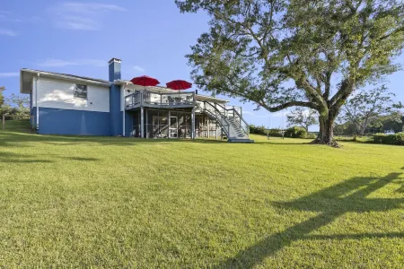 Twin Palms - water views! close to downtown Ocean Springs! With game room & dock