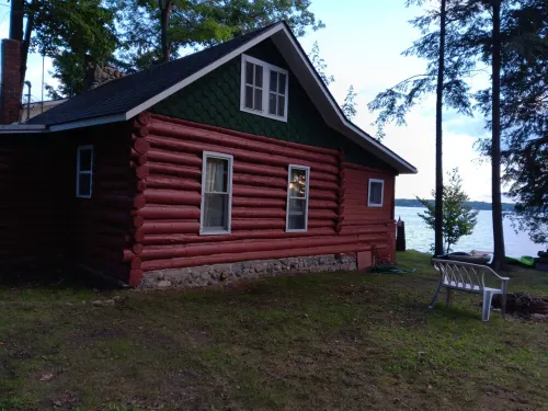 Beautiful full log cabin with  direct private frontage , beautiful sunsets .
