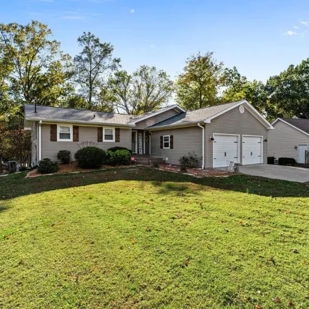 3 bedroom/2 full bath lakefront home with gentle slope to private covered dock