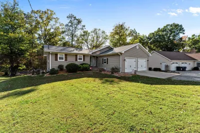 3 bedroom/2 full bath lakefront home with gentle slope to private covered dock