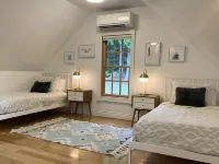 Amazing sunsets!! Water view, hot tub, close to town, fire pit.