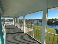Raised home right on the Caloosahatchee River. Come enjoy the water and weather