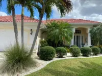 Stunning SW home w/perfect indoor-outdoor living! Infinity pool/spa/great canal.