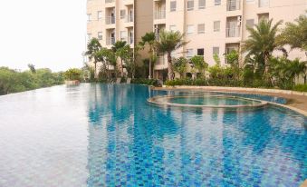 Cozy 1Br Apartment with Workspace at Mustika Golf Residence