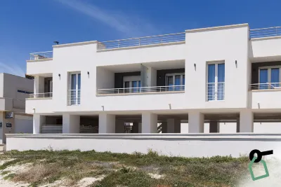HOTIDAY Apartment Collection - Torre Lapillo Hotels near Lido Leucasia Golden Beach