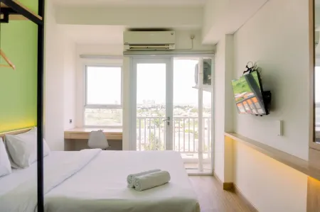 Homey and Cozy Living Studio Poris 88 Apartment