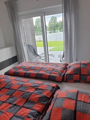 Vacation home right on the lake with sauna, air conditioning and private beach Hotels in Barßel