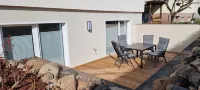 Charming apartment with sauna and large terrace, just a few steps from the beach.