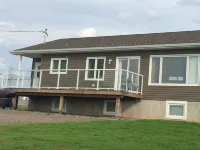 Main Floor (Unit 1) in House, Deck, Sunset, Water View (Cheticamp Harbour) Hotels in Cheticamp