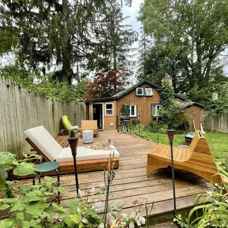 Cozy cabin with deck and fireplace steps from White Pond Lake. Dog friendly.
