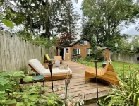 Cozy cabin with deck and fireplace steps from White Pond Lake. Dog friendly.